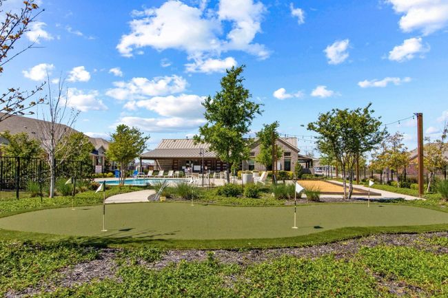 Woodbridge Villas putting green, community pool, clubhouse with exercise facility. | Image 17