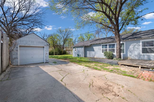 1 car garage is currently used as a storage shed, space is available for a new multi car garage to be built | Image 37