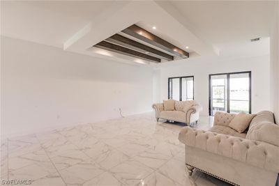 Tiled living room with beamed ceiling | Image 3