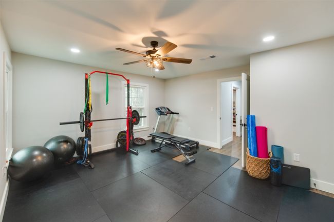 Workout room with baseboards, visible vents, ceiling fan, and recessed lighting | Image 8