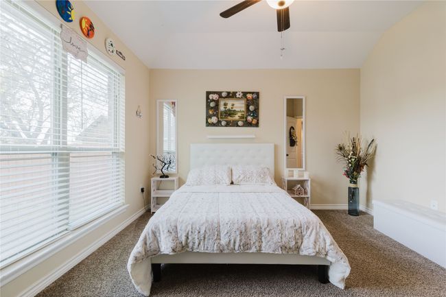 Bedroom #2 Carpeted bedroom with ceiling fan and vaulted ceiling | Image 16