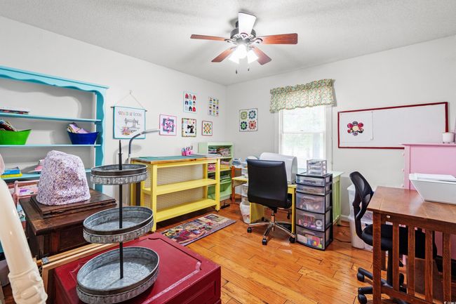 Office area with ceiling fan, hardwood / wood-style floors, and a textured ceiling | Image 14