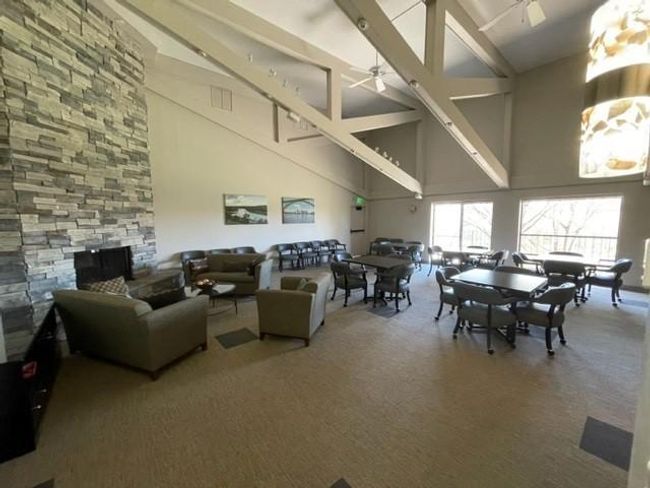 spacious community room with fireplace and | Image 25