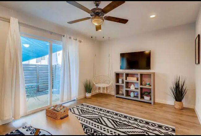 Living room featuring baseboards, wood finished floors, a ceiling fan, and recessed lighting | Image 6