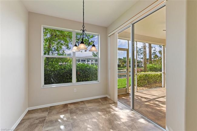 Unfurnished dining area featuring baseboards and an inviting chandelier | Image 21