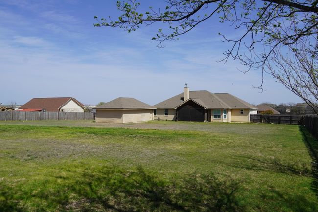 View of yard with a fenced backyard | Image 22
