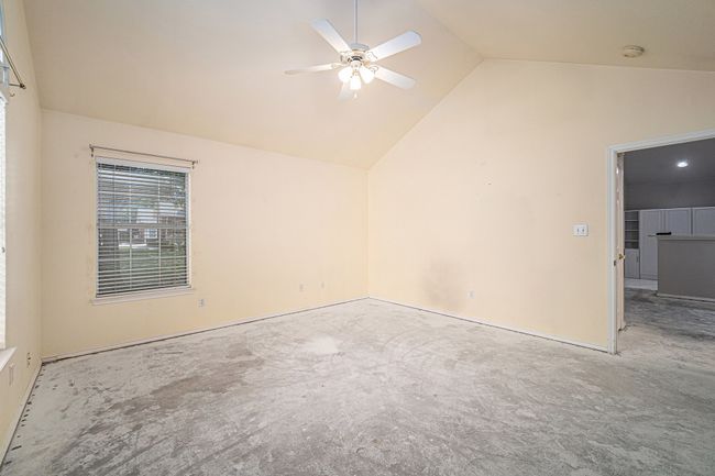 Second Primary Bedroom with ceiling fan and vaulted ceiling. | Image 16