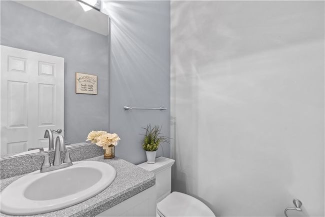 Half bath featuring vanity and toilet | Image 27