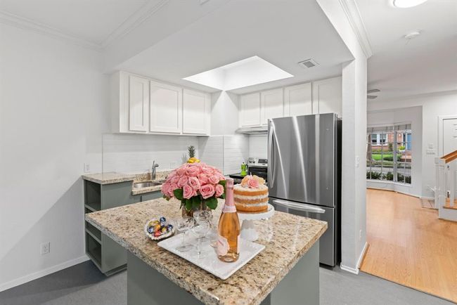Open concept kitchen just off living room. Moveable granite island perfect for a breakfast bar or entertaining guests | Image 5