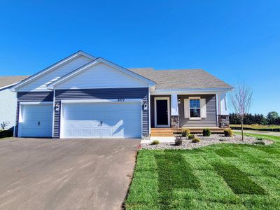 Open kitchen with excellent lighting and quality finishes. Photo of Model Home. Options and colors may vary. Ask Sales Agent for details. | Image 2