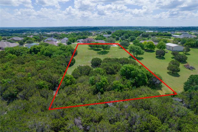 View of property location with property parcel outlined and a heavily wooded area | Image 38