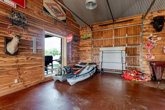 Garage featuring wood walls | Image 12