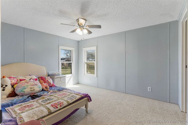 One of four bedrooms, this one has a walk in closet | Image 30