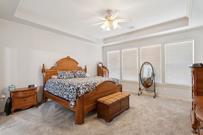 Large primary bedroom on main floor with private access to covered patio. | Image 25