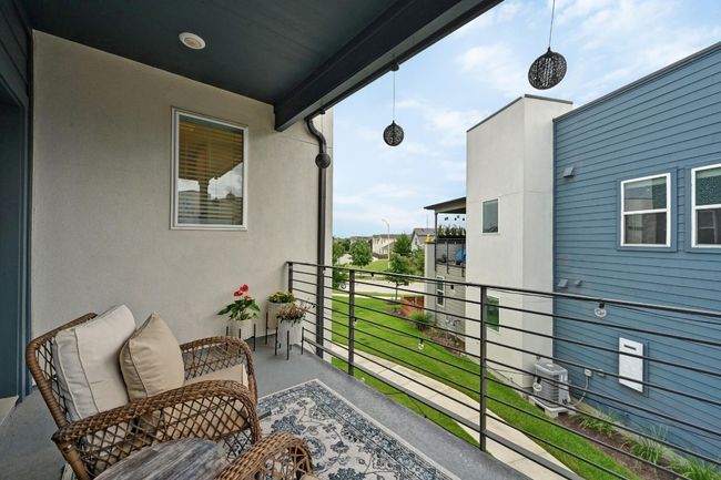 This private balcony offers a quiet corner to unwind, surrounded by the charm of the Goodnight neighborhood | Image 18