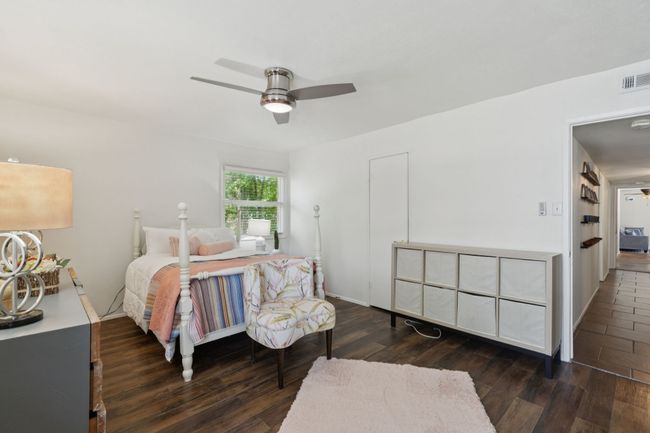 Primary Bedroom with wood finished floors and a ceiling fan | Image 8