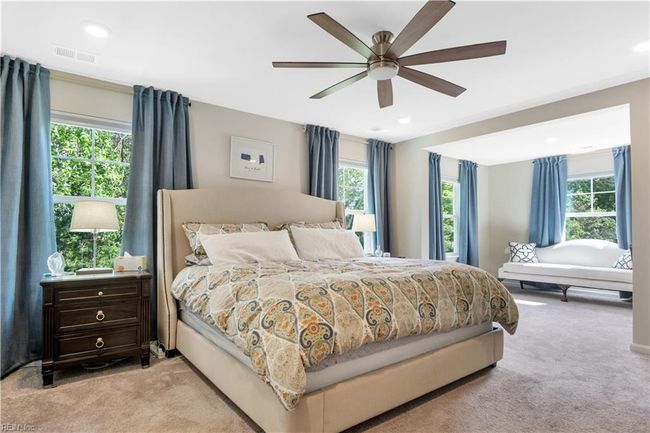 Main Bedroom with large windows taking in the water view. | Image 21
