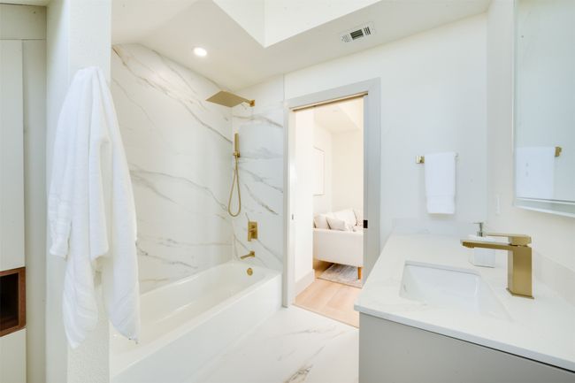 Bathroom with vanity, shower / bathing tub combination, and wood-type flooring | Image 34