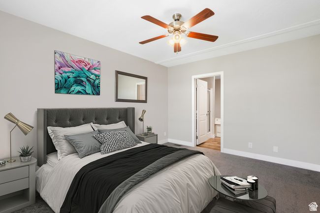 Bedroom with carpet floors, baseboards, a ceiling fan, and ensuite bath | Image 7