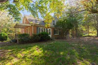 View of property exterior with a lawn | Image 2