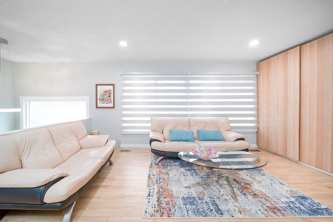 Living room featuring visible vents, wood finished floors, and recessed lighting | Image 9