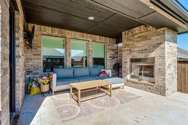View of patio featuring an outdoor living space with a fireplace | Image 6