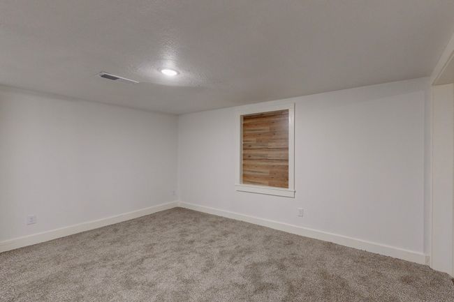 Carpeted spare room with a textured ceiling | Image 32