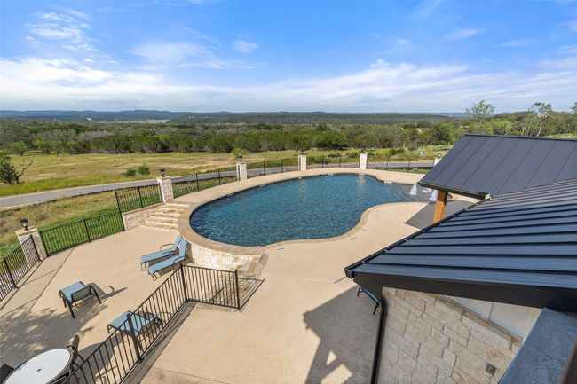 View of pool featuring a patio area | Image 23