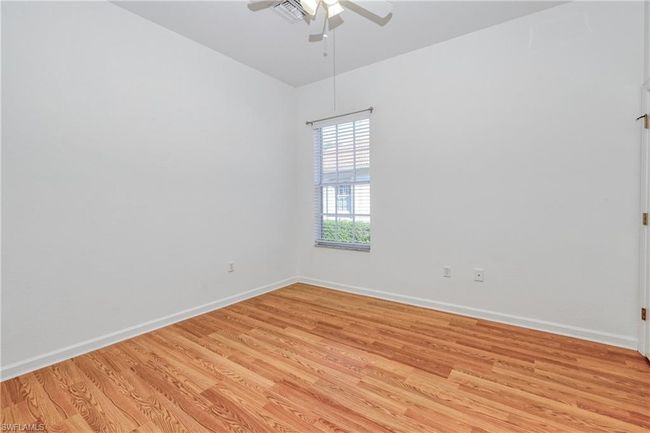 Unfurnished room with ceiling fan and light wood-type flooring | Image 7