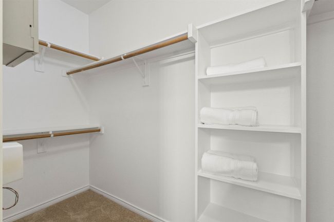 Spacious closet featuring carpet flooring | Image 16
