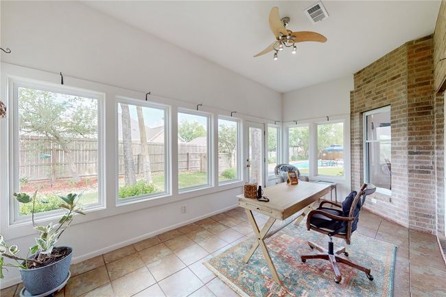 Office featuring visible vents, a ceiling fan, baseboards, and light tile patterned floors | Image 15