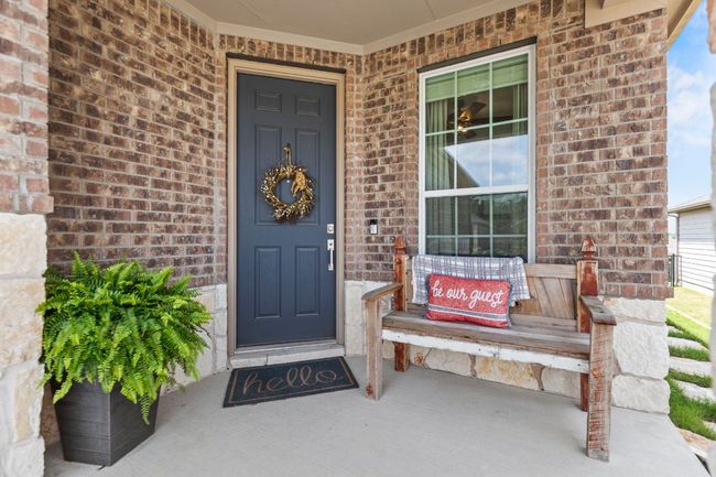 Property entrance with covered porch and brick siding | Image 4