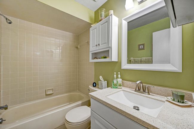 Hallway to Guest Bathroom and Stackable In-Unit Laundry Area | Image 29