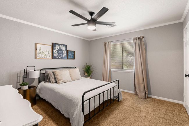Second upstairs bedroom with a bright, comfortable layout | Image 16