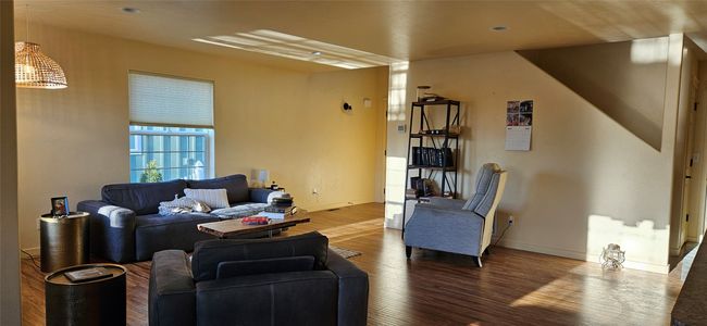 Living area with baseboards and wood finished floors | Image 5