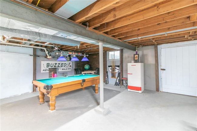 Unfinished basement featuring pool table | Image 35