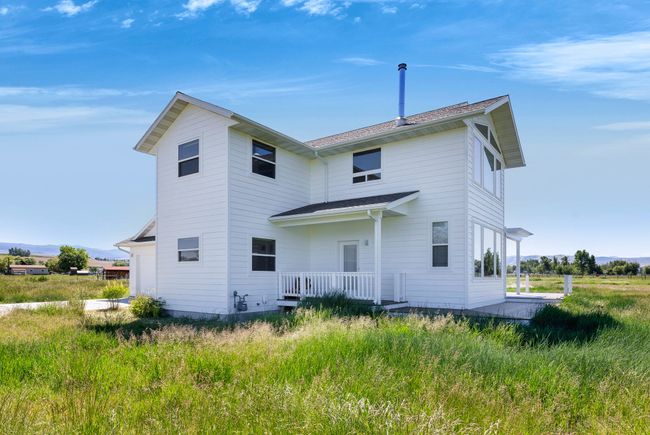 Back of property featuring a porch | Image 53