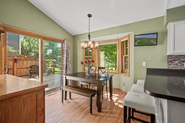 Enjoy large gatherings or simple meals in this dining room. Natural light shines through the patio doors to brighten up this whole level. | Image 10