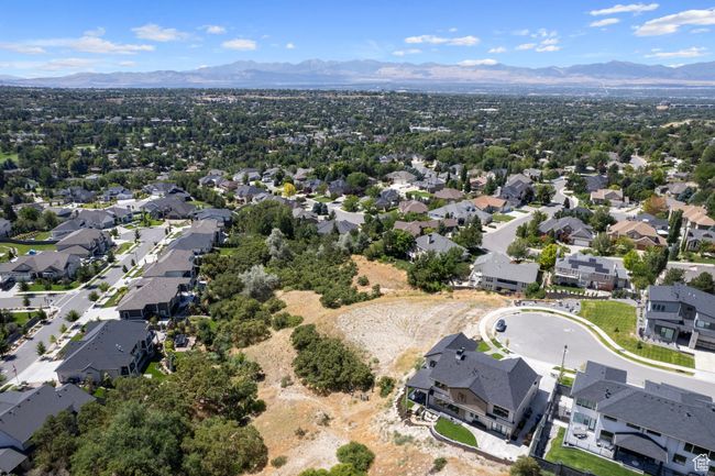 Aerial perspective of suburban area featuring a mountainous background | Image 39