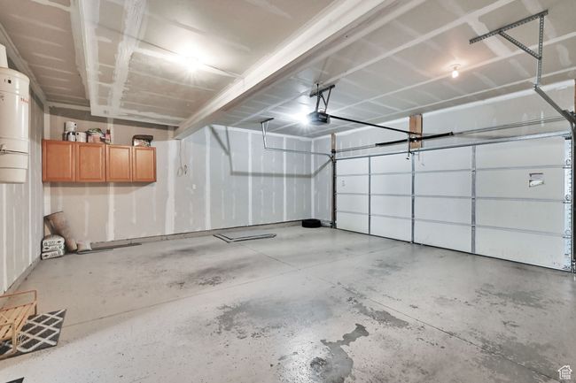 Garage with a central vacuum unit and a garage door opener | Image 28