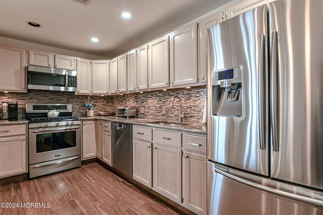 Kitchen with abundant storage | Image 11