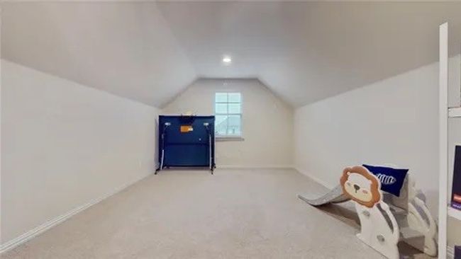 Bonus room featuring lofted ceiling and carpet flooring | Image 10