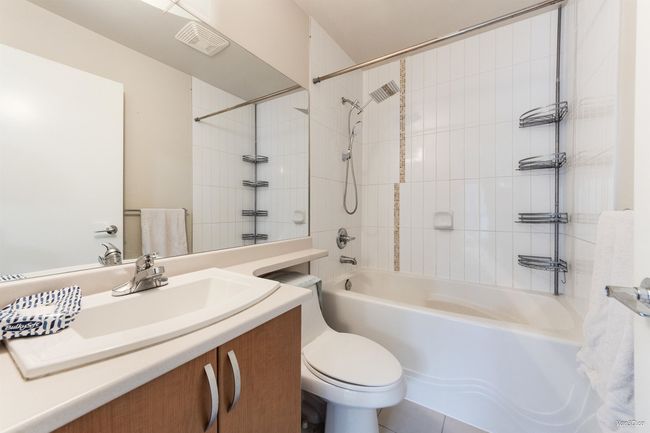 Bathroom featuring shower / bath combination and vanity | Image 16