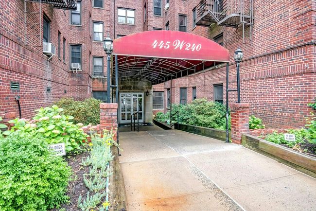 View of exterior entry with french doors, brick siding, and cooling unit | Image 20