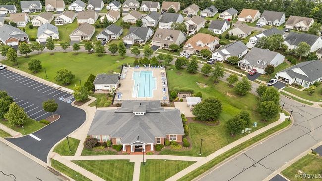 Aerial view of property and surrounding area featuring a pool and nearby suburban area | Image 38
