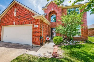 Front of property featuring a garage and a front yard | Image 1