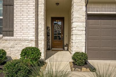 Beautiful brick and stone elevation with upgraded glass door entry. | Image 2