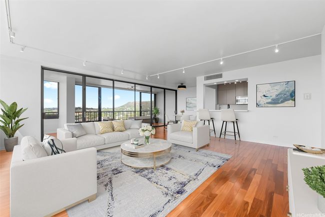 View from living room looking out towards Diamond Head. New track lighting enhances this spacious living area! Virtually Staged(enhanced) | Image 4
