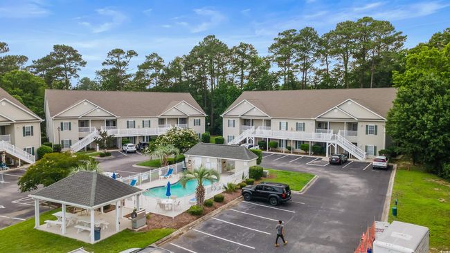 Aerial view of residential area featuring a pool area | Image 38