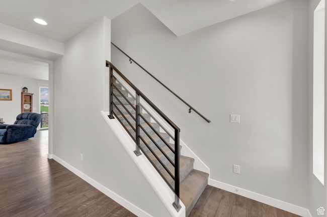 Stairs featuring wood finished floors and recessed lighting | Image 14